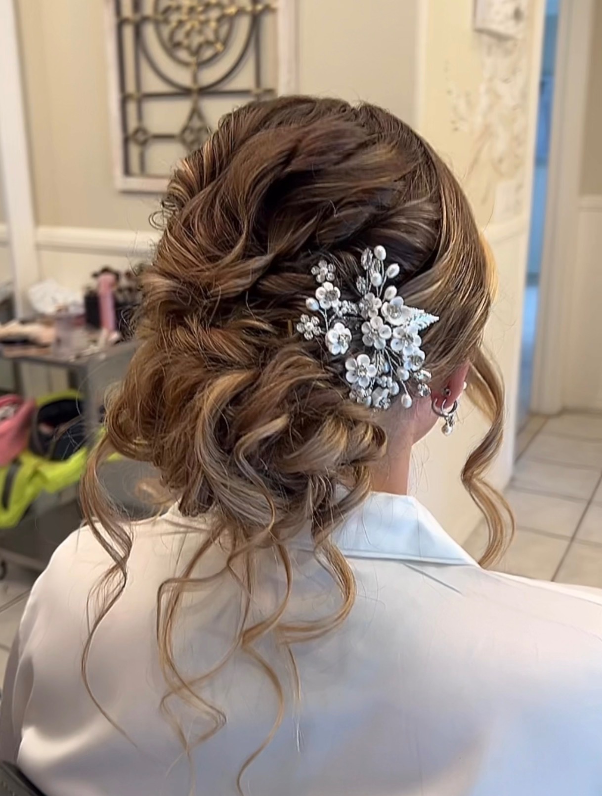 Bridal updo with hairpiece by Jazlyn